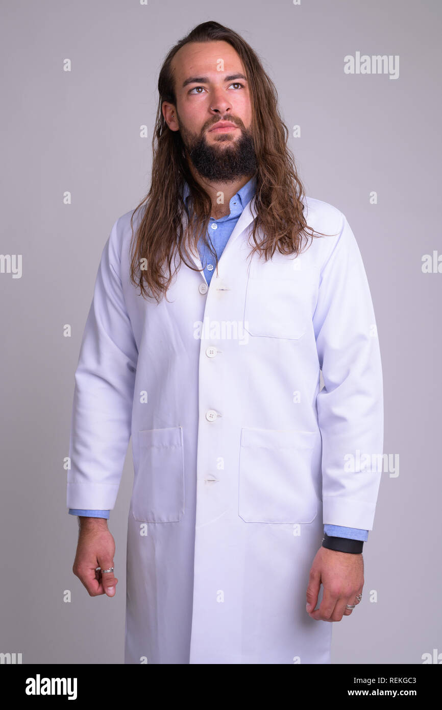 Young unshaven male doctor hi-res stock photography and images - Alamy