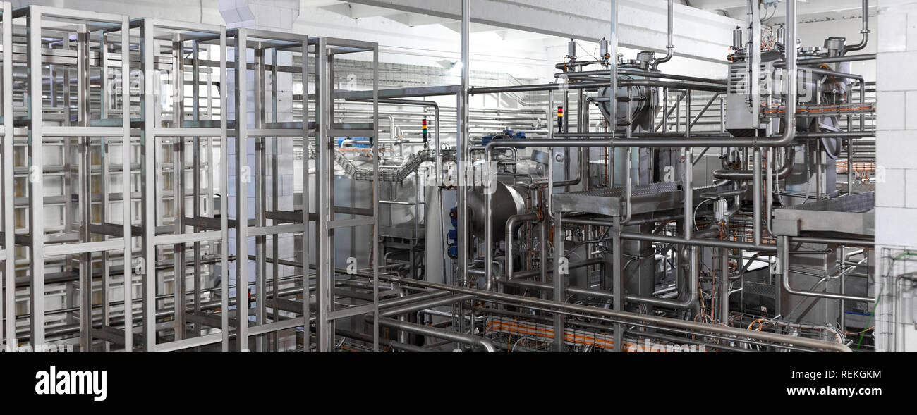Equipment, cables and piping found inside of modern industrial plant Stock Photo