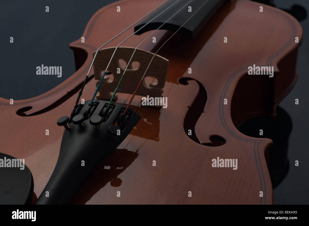 Violin musical instruments of orchestra closeup on black Stock Photo