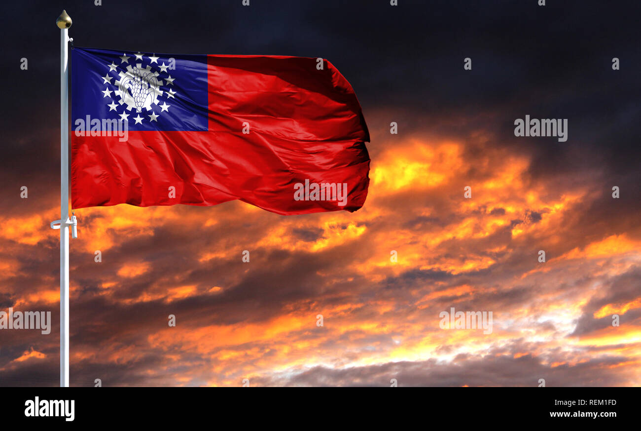 flag of Myanmar Burma on flagpole fluttering in the wind against a ...