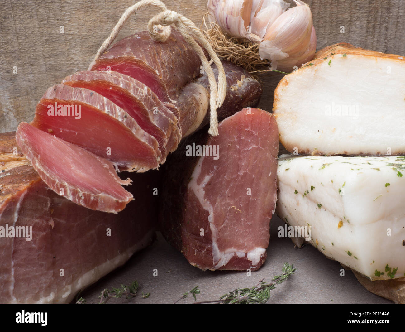 group of smoked Ham, jerky, salted biltong meat, lard with some garlic