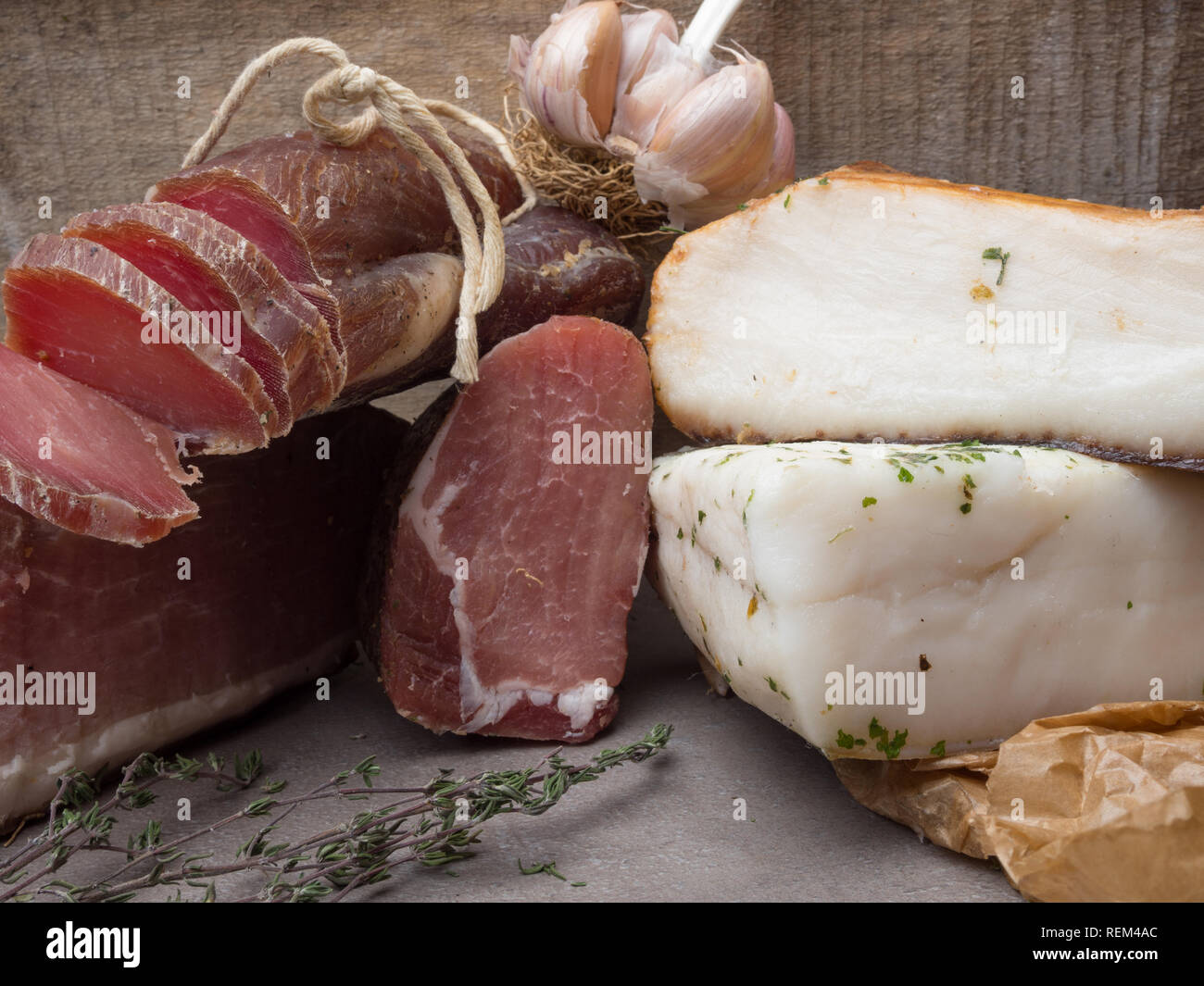 group of smoked Ham, jerky, salted biltong meat, lard with some garlic