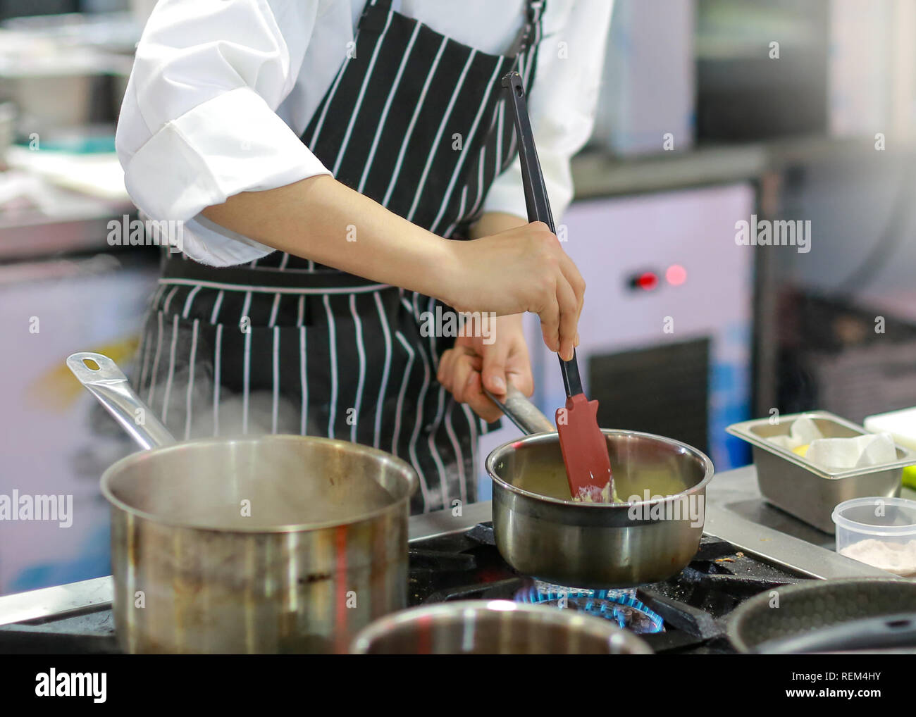 Chef cooking food in the kitchen, Chef preparing food Stock Photo - Alamy