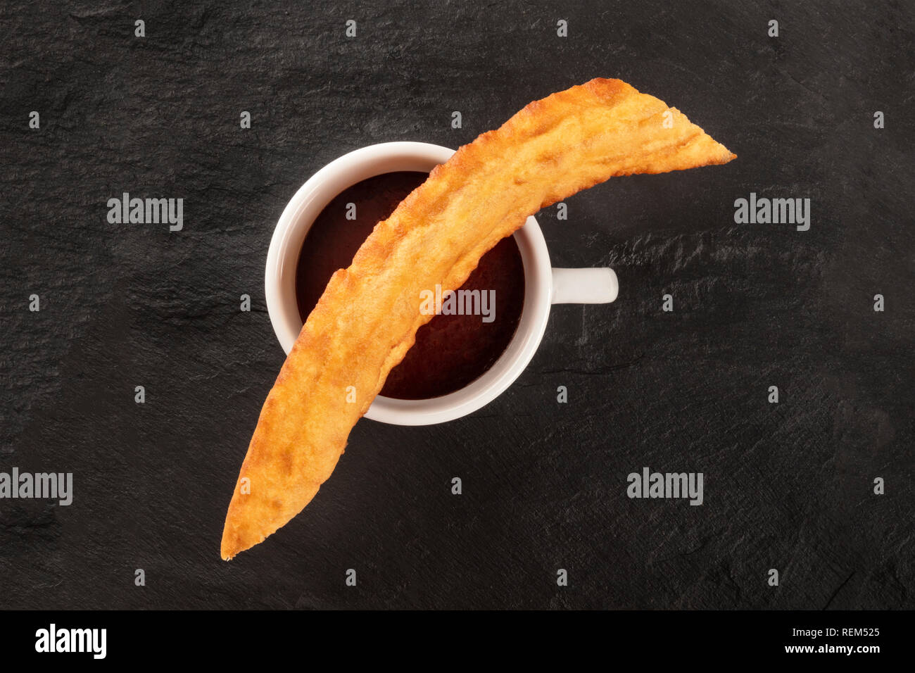 Traditional Spanish porras with hot chocolate, a typical Madrid Sunday