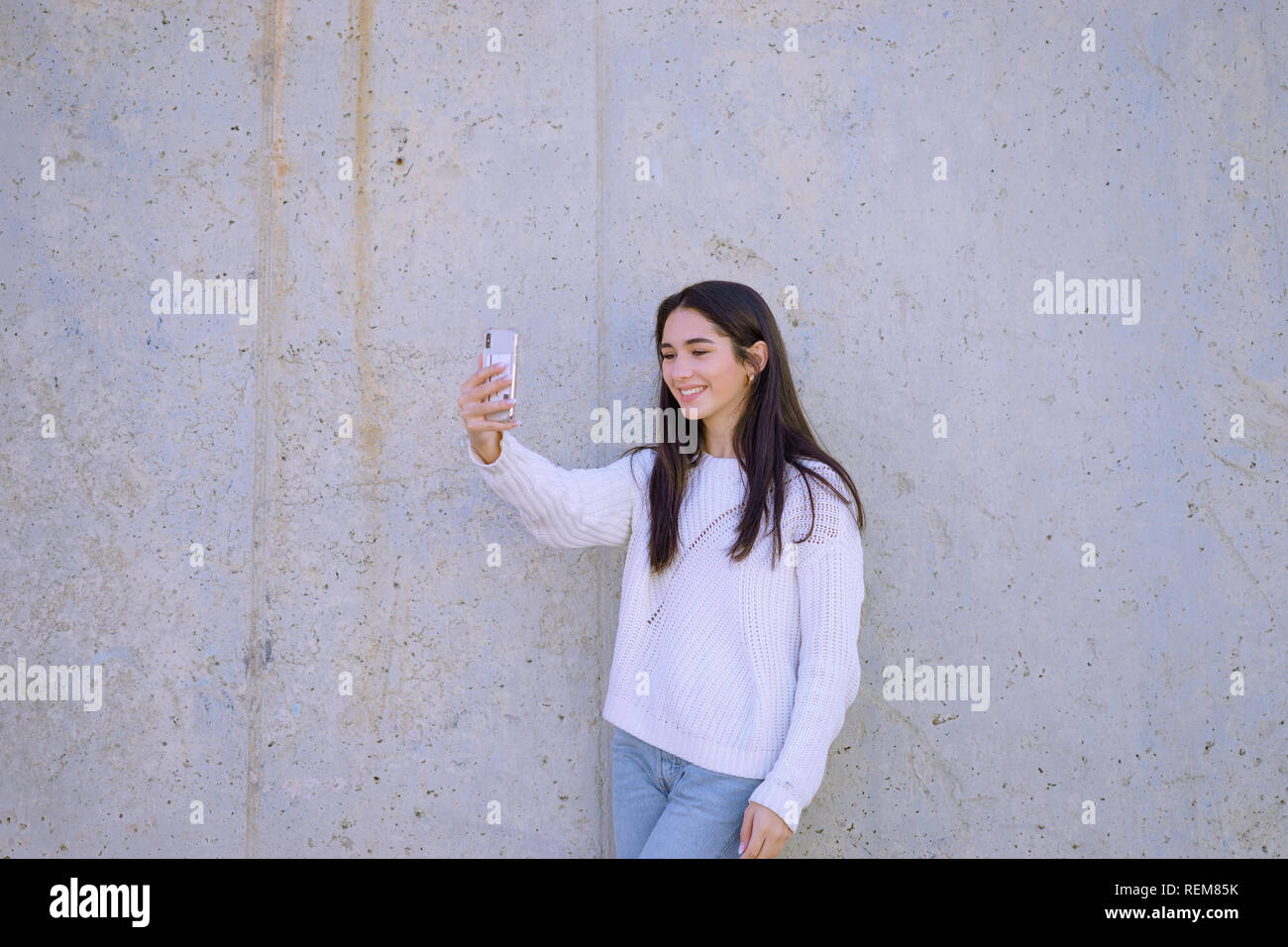 Happy young woman taking selfie - image Stock Photo - Alamy