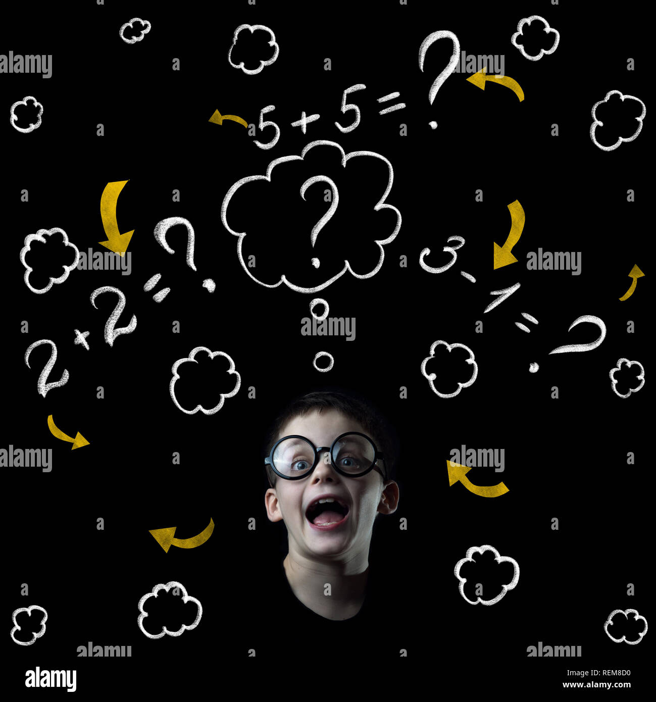 Boy Solve Mathematics Examples At The Blackboard On Black Background Boy solve mathematics examples at the blackboard on black background