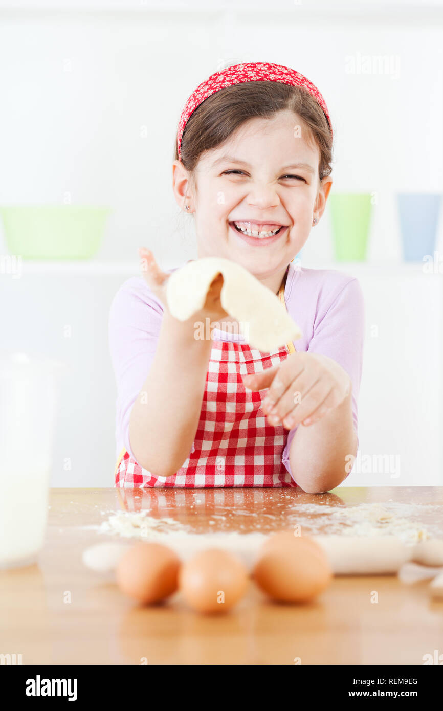Little girl making the dough Stock Photo Alamy