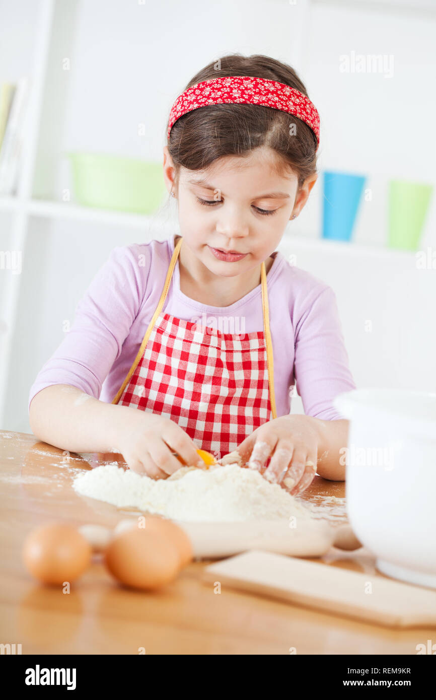 Little girl making the dough Stock Photo Alamy
