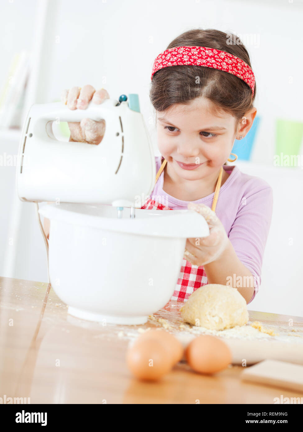 Little girl making the dough Stock Photo Alamy