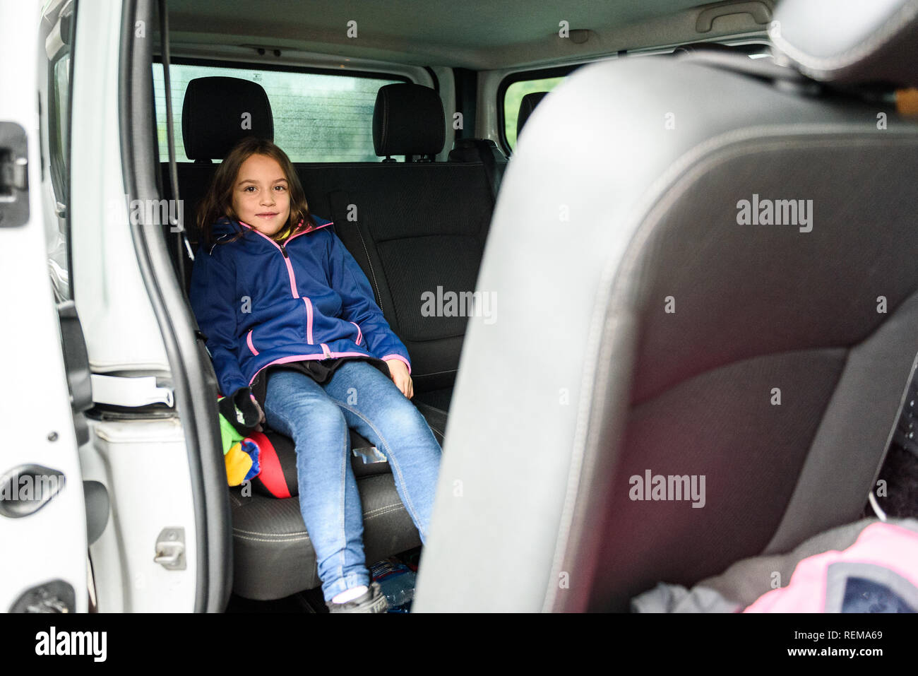 Family travelling in minivan to airport. People on public transport bus or van are travelling to airport for vacation. Aerodrome transfer service vehi Stock Photo