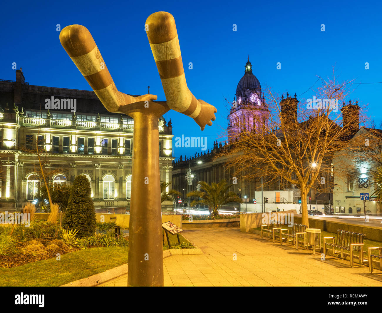 Leeds Town Hall from the Both Arms sculptureby Kenneth Armitage in Mandela Gardens at Dusk Leeds West Yorkshire England Stock Photo