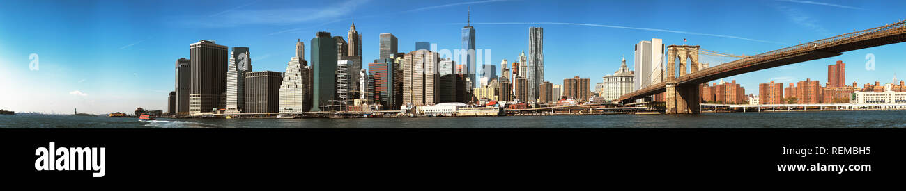 The New York City Downtown skyline at the afternoon w Brooklyn Bridge Stock Photo