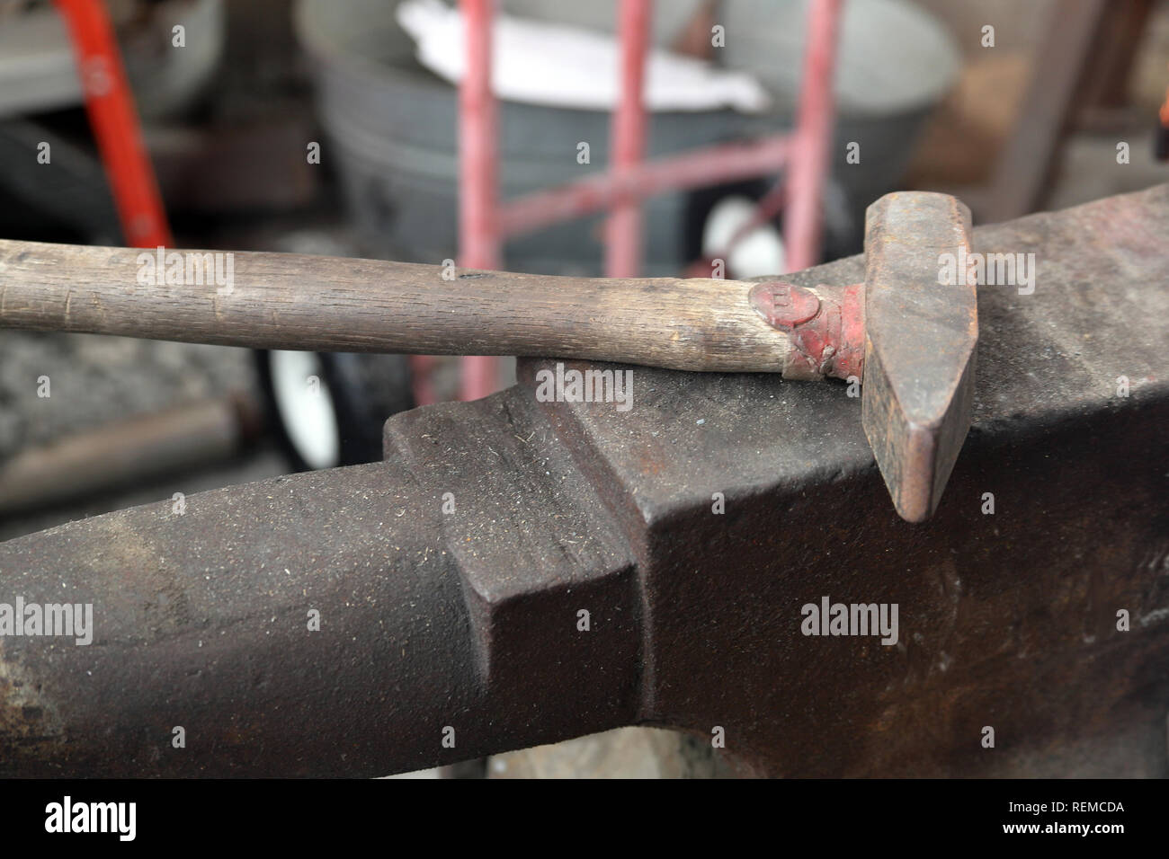 Blacksmith tools anvil and hammer in workshop Stock Photo