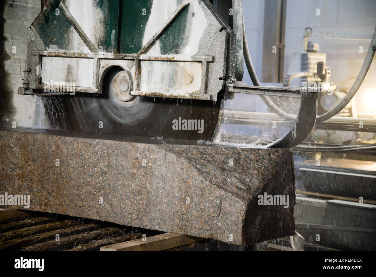 Granite processing in manufacturing. Cutting granite slab with a circular saw Stock Photo Alamy