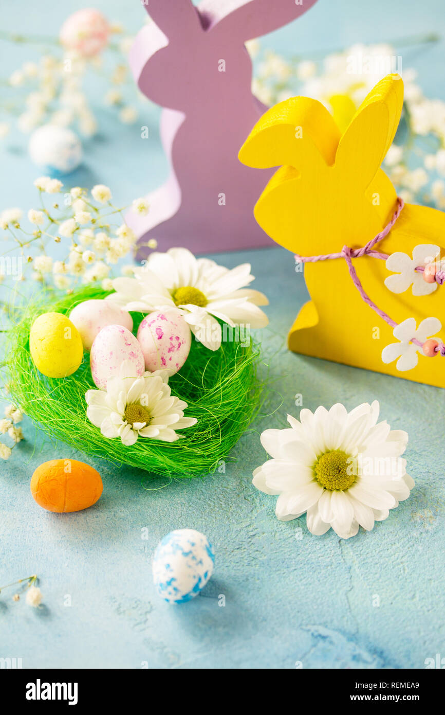 Happy Easter Card. Congratulatory easter background. Easter eggs, Easter eggs cute bunny and flowers. Stock Photo