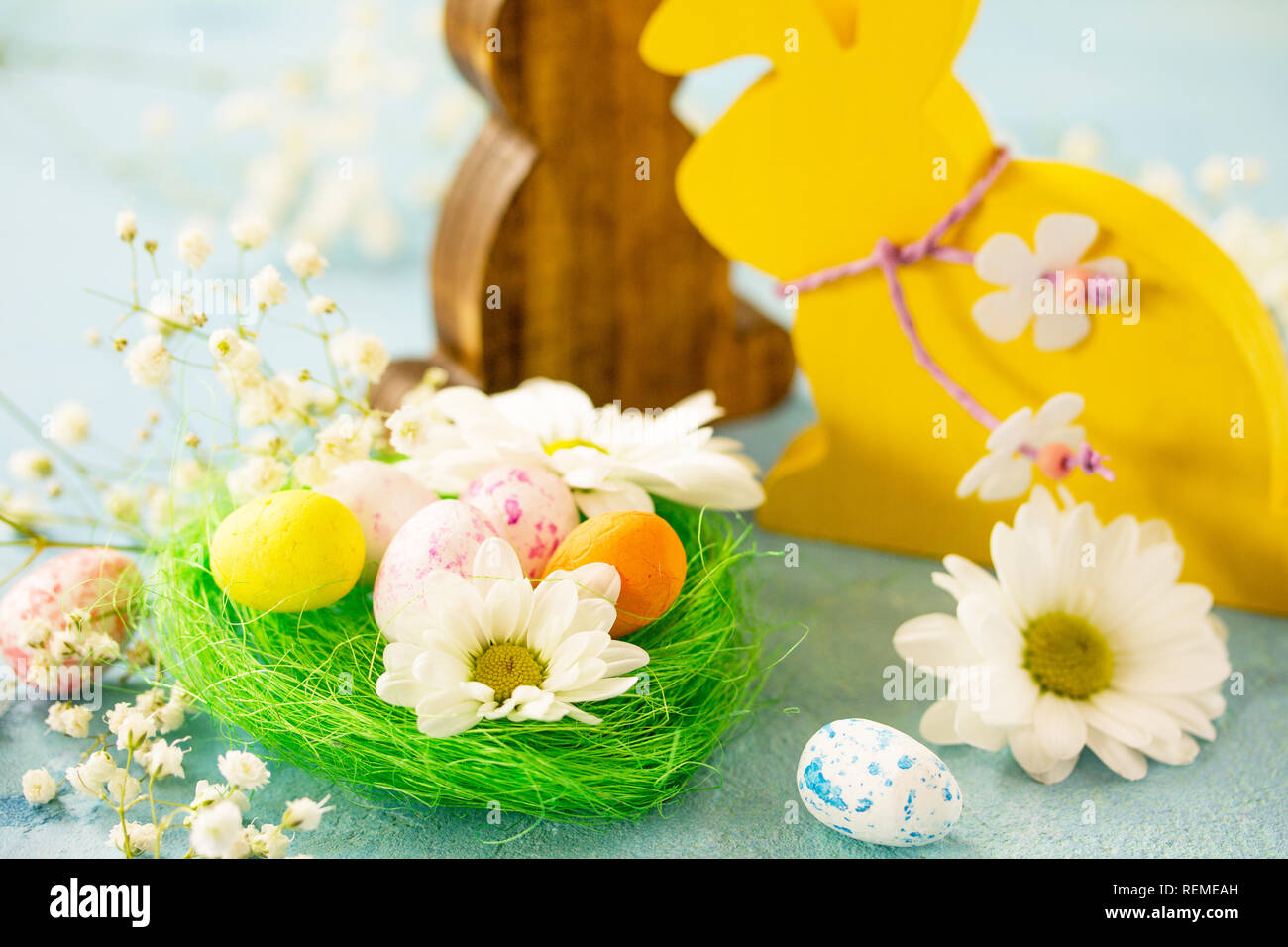 Happy Easter Card. Congratulatory easter background. Easter eggs, Easter eggs cute bunny and flowers. Stock Photo