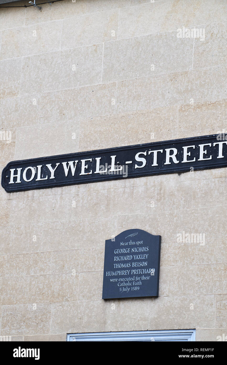 Plaque at Holywell street on a wall of New college, university of Oxford, England, commemorates four Catholic christians martyrs executed for their re Stock Photo