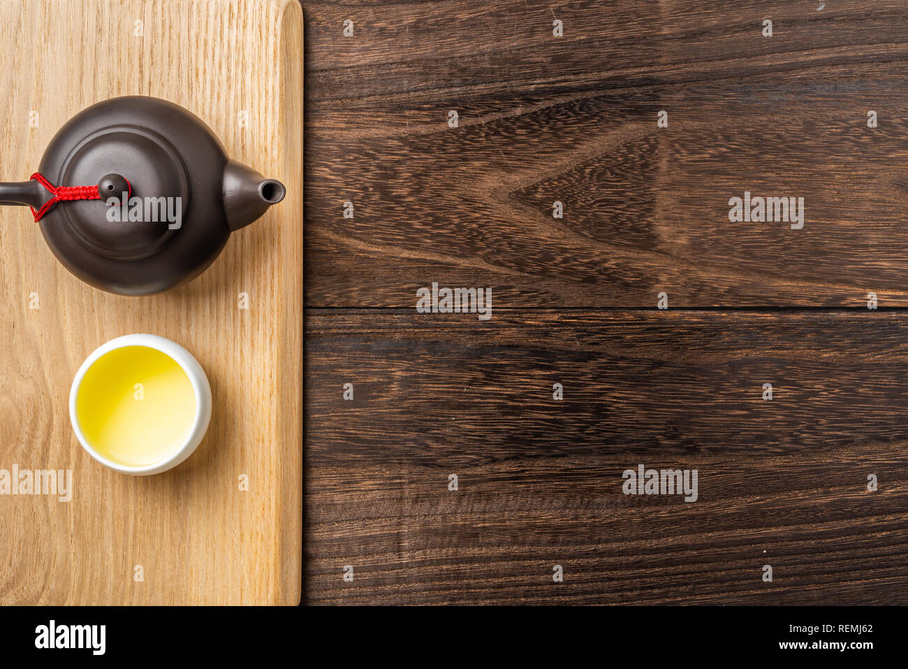 Asia culture and design concept - fresh taiwan oolong tea and teapot on dark wood background Stock Photo