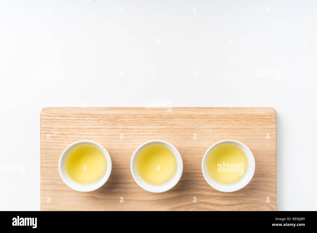 Asia culture and design concept - fresh taiwan oolong tea and cup with wood board Stock Photo