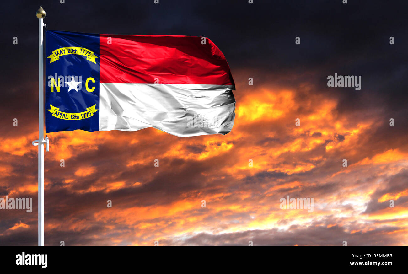 flag State of North Carolina on flagpole fluttering in the wind against ...