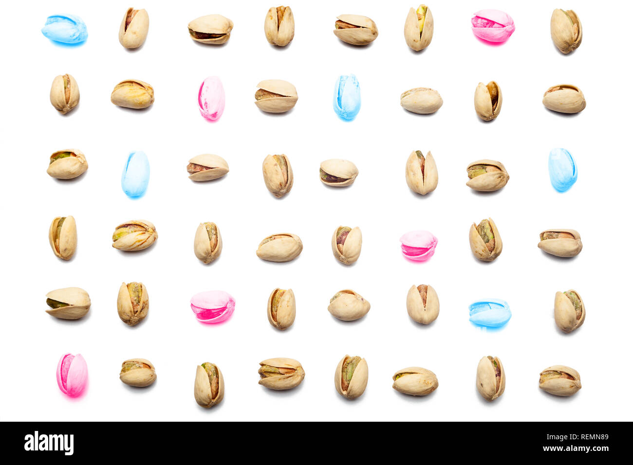 Many colors Inshell pistachios and cracked pistachios on white