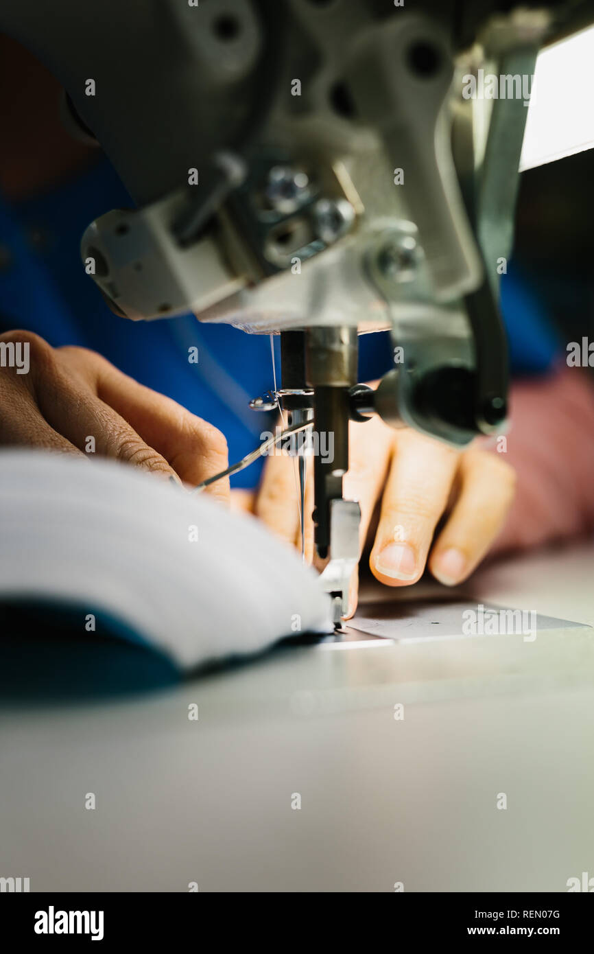 Mature Male Dressmaker Stitching Cloth On Sewing Machine High-Res Stock  Photo - Getty Images