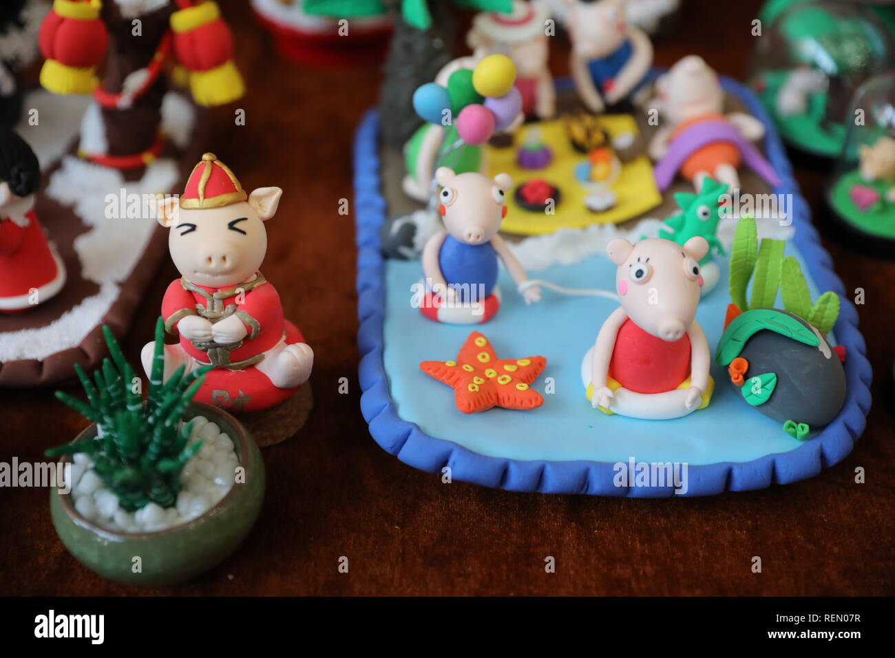 Xi'an, China. 22nd Jan, 2019. Various clay statues of cartoon