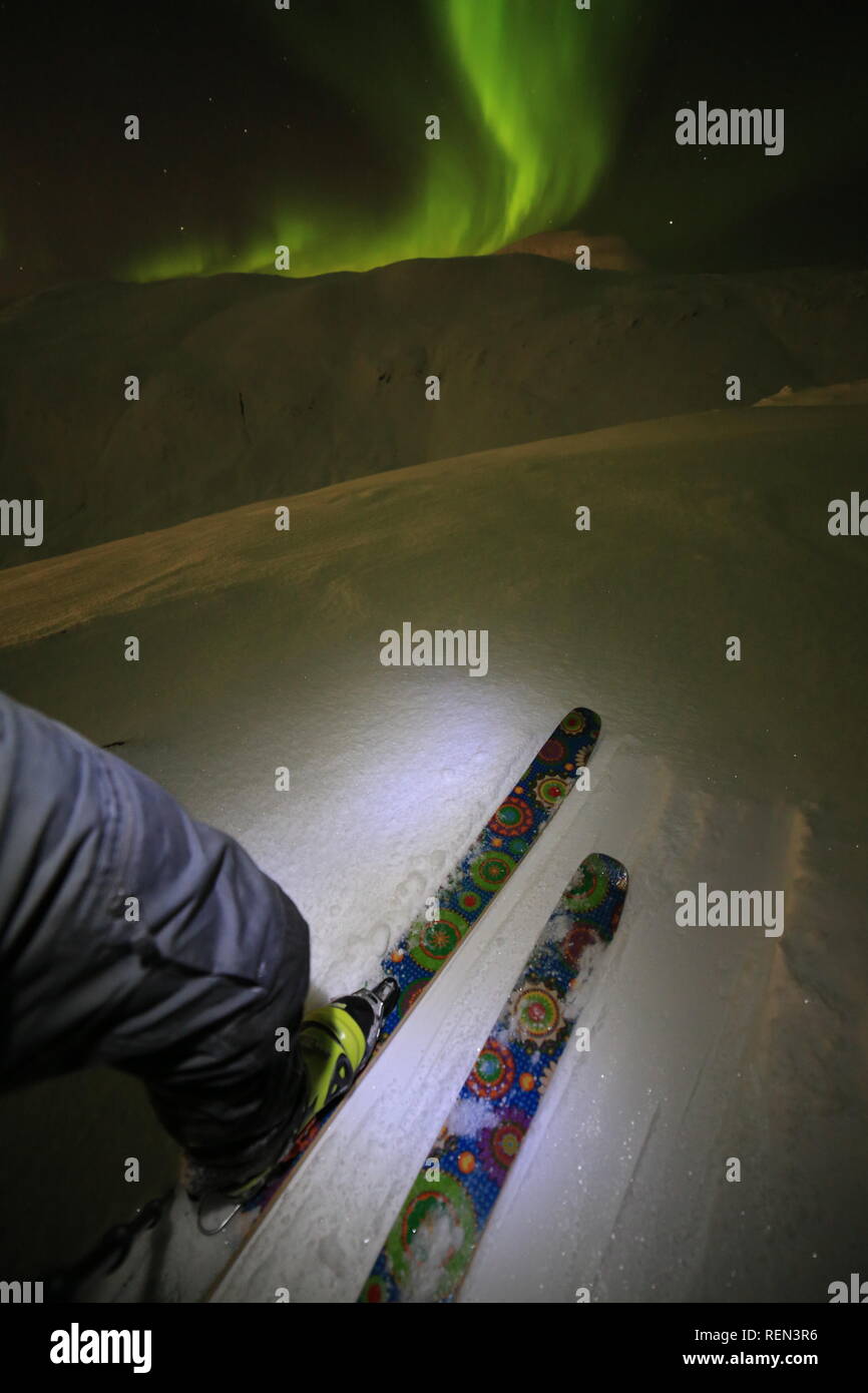 Northern Lights, Skiing And Hiking In Snowy Winter Mountains At Night