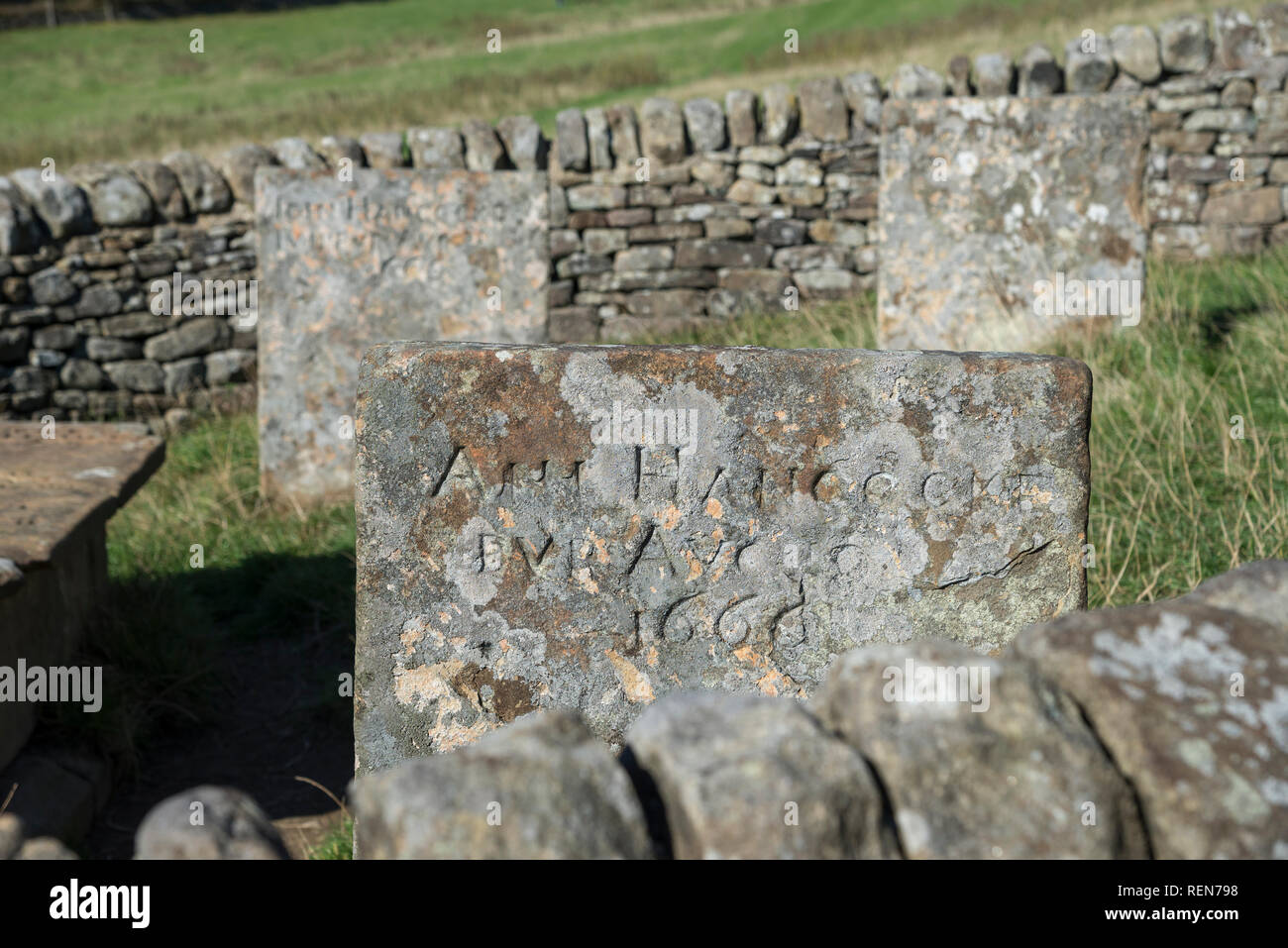 Close up of gravestone in the Riley Graves near Eyam in the Peak District, Derbyshire, England. Victims of the 17th century outbreak of plague. Stock Photo
