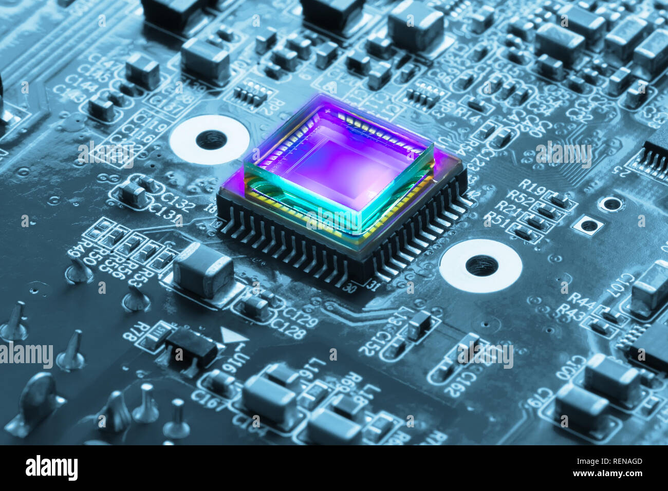 photosensitive sensor on a printed circuit board closeup with a violet glow Stock Photo