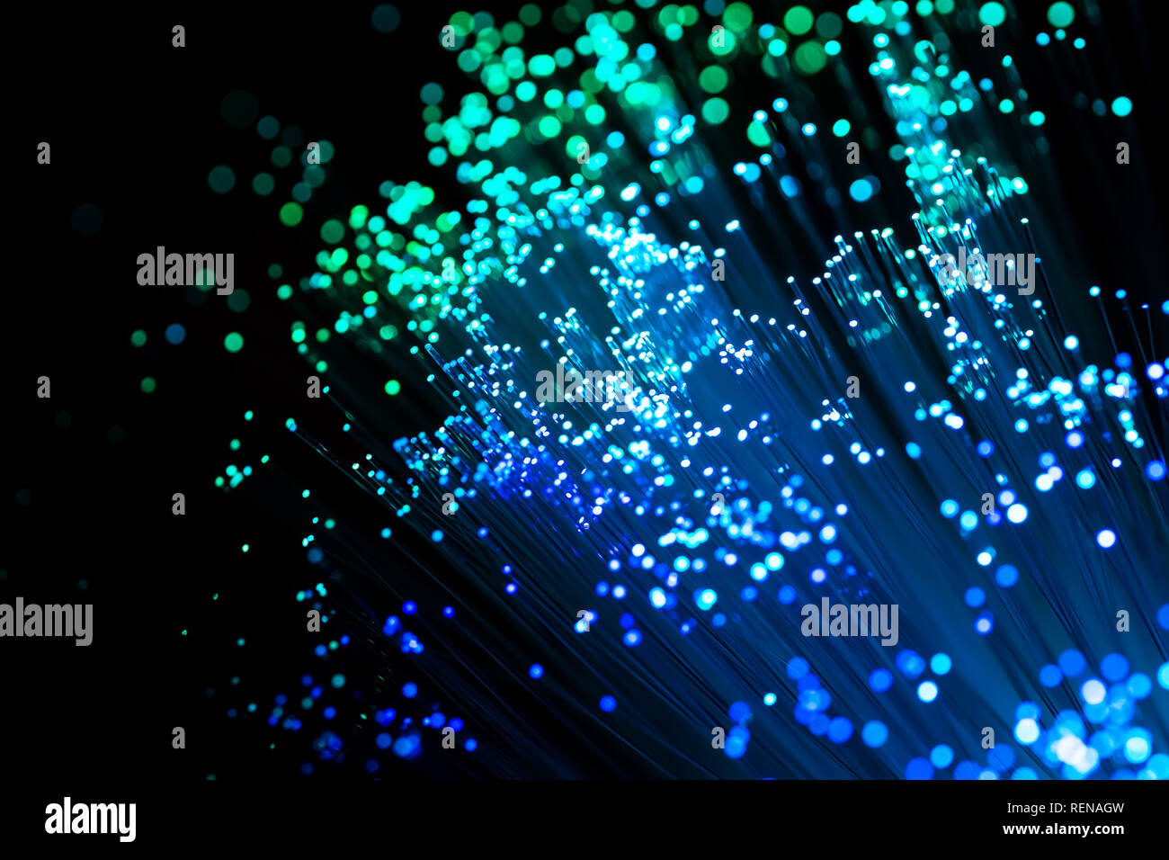 Abstract high-tech background of glowing fiber optic cable Stock Photo