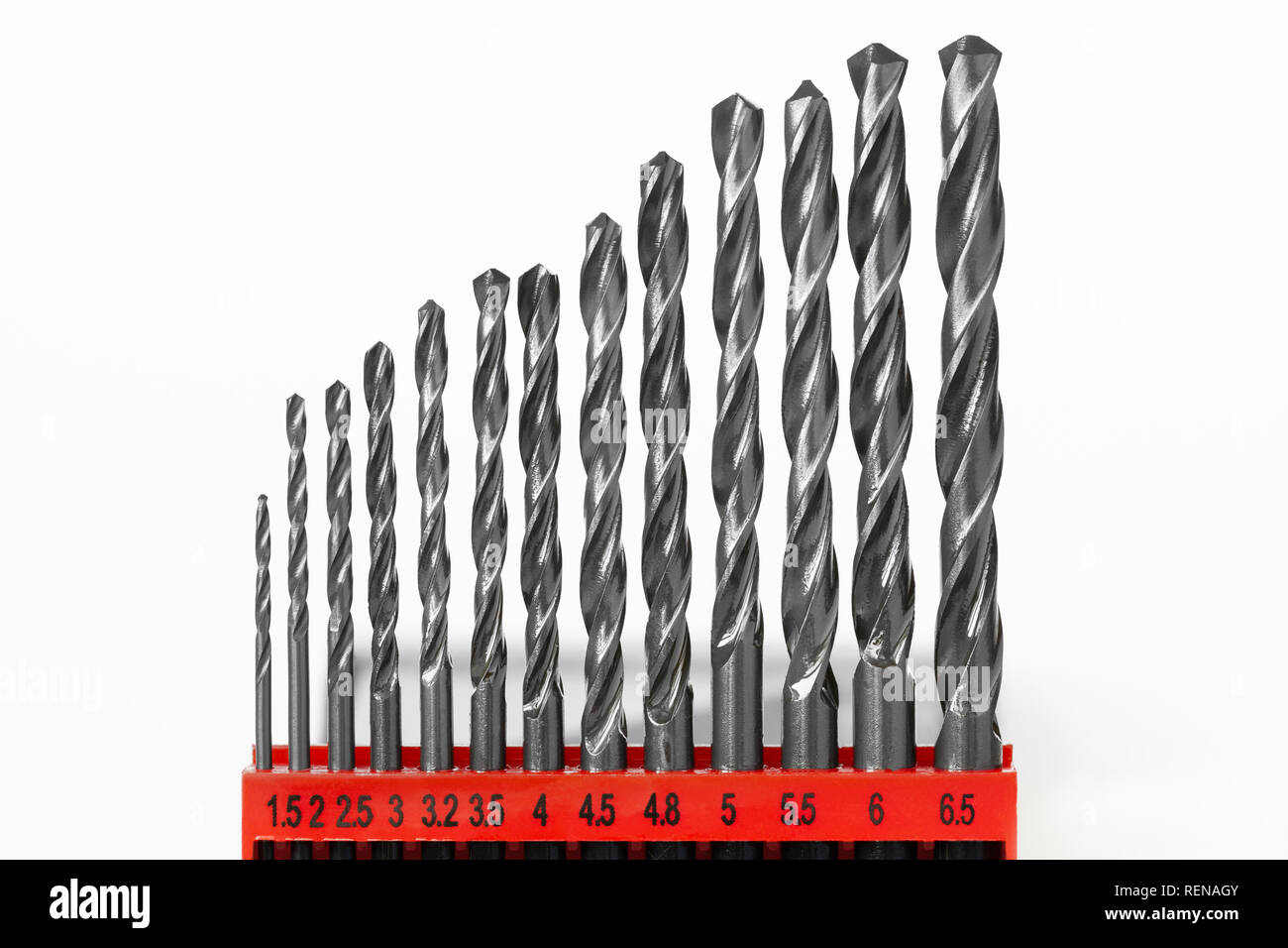 Set of drill bits for metal in a red holder on a white background Stock Photo