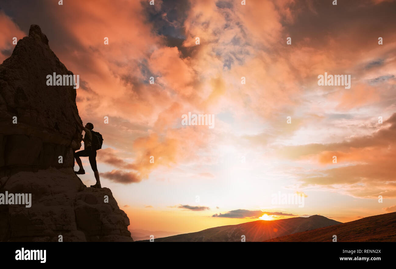 silhouette of successful climbing woman in mountains Concept of concept