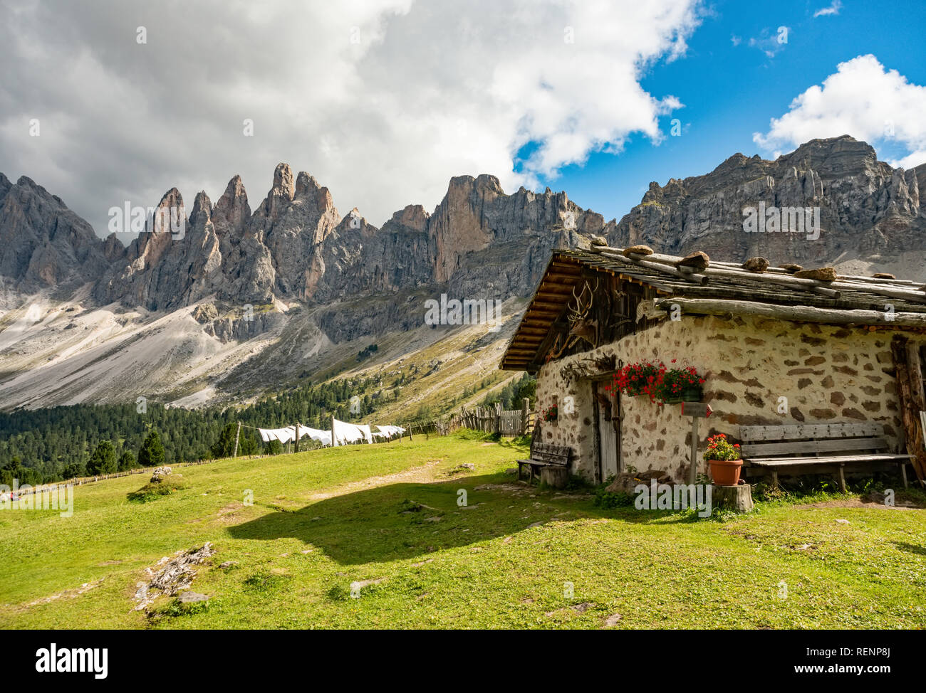 Beautiful mountain landscape of rifugio Brogles in Dolomites Italy. Tranquil hutte on top of mountain Stock Photo