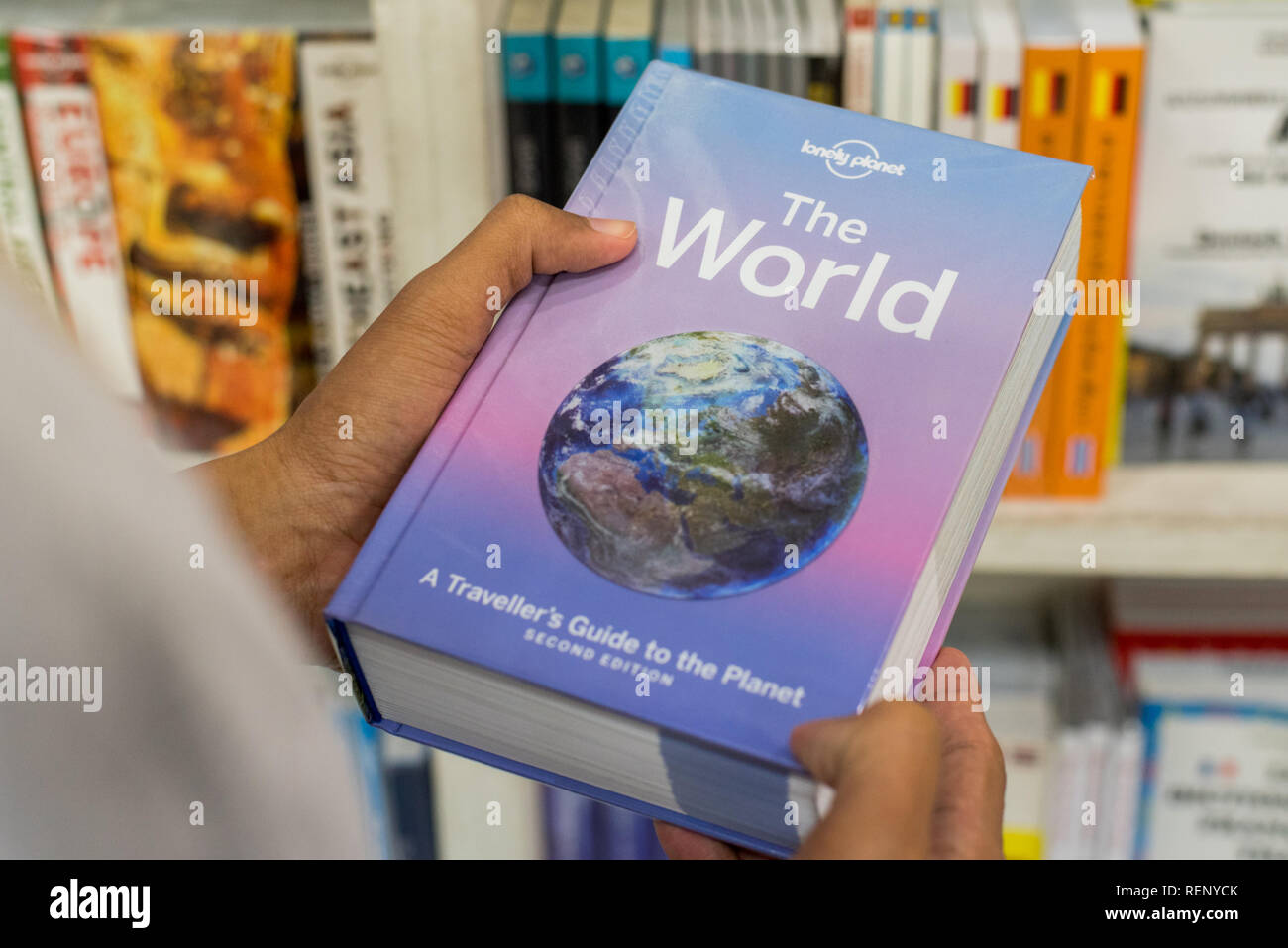Bangkok, Thailand - July 21, 2018: Lonely Planet guidebook The World, A Traveller's Guide to the Planet, Second Edition. Stock Photo