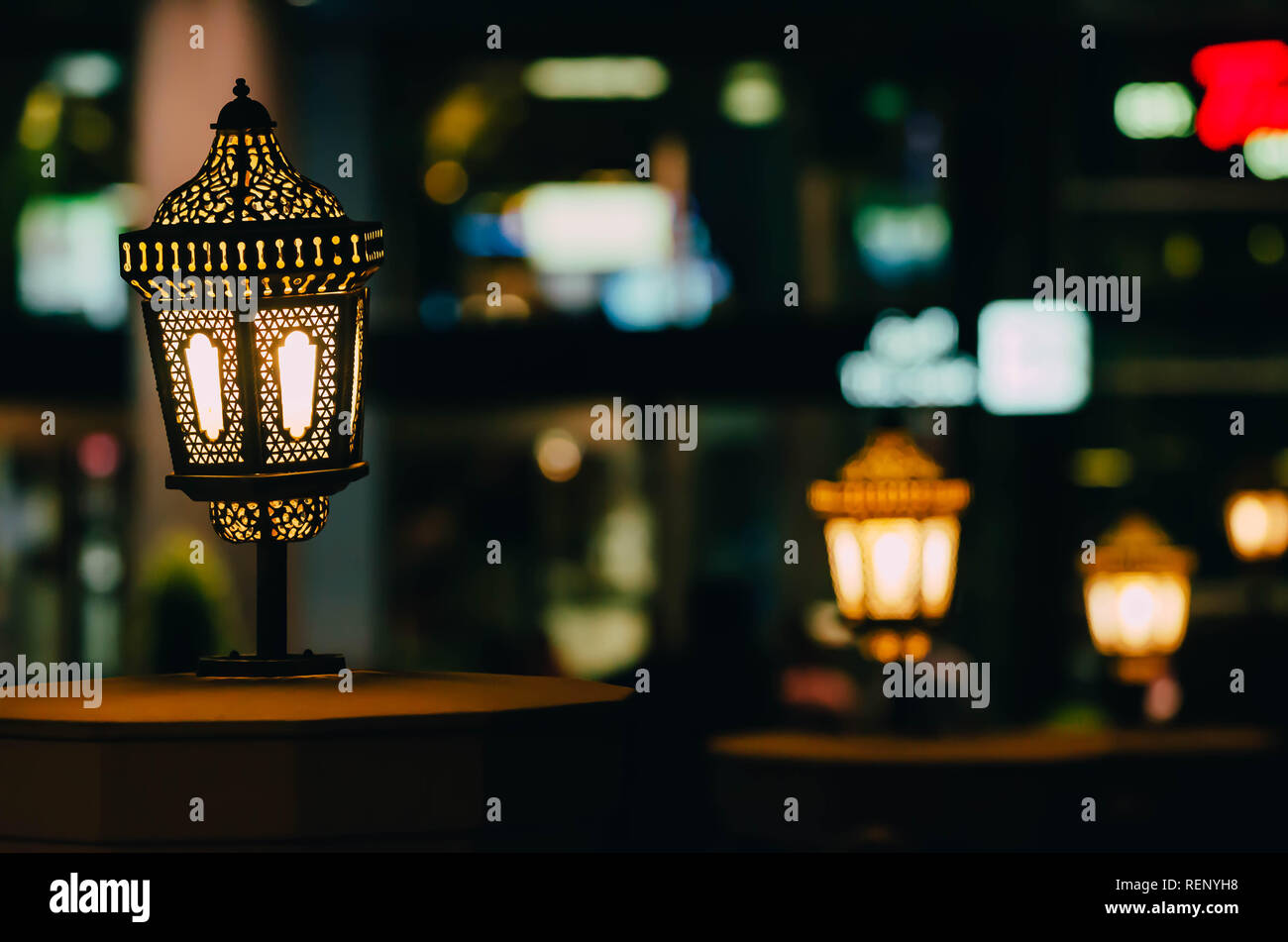 Arab street lanterns illuminate in the night city of Dubai in the