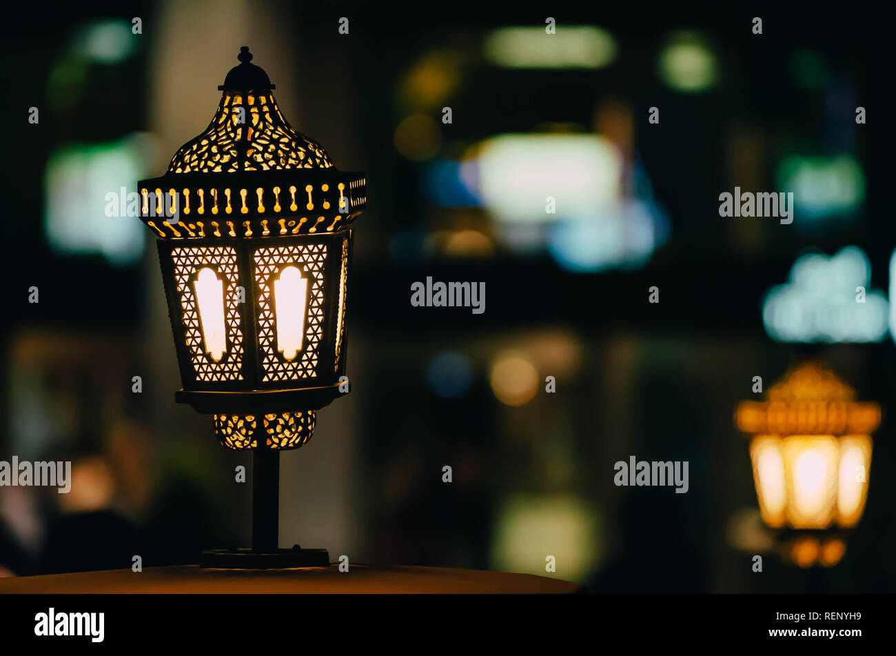 Arab street lanterns illuminate in the night city of Dubai in the