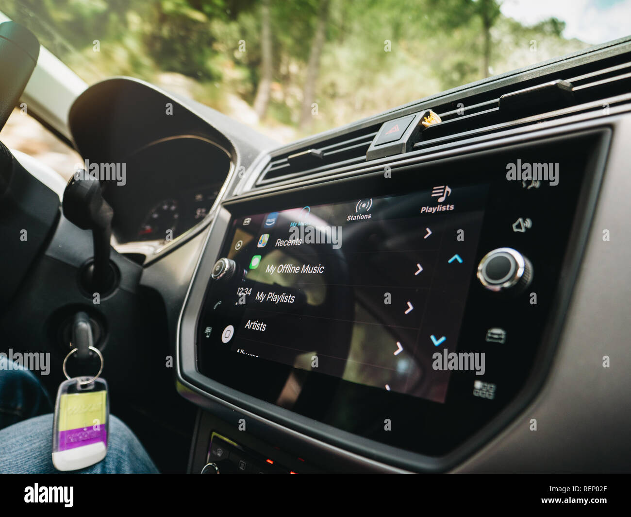 PALMA DE MALLORCA, SPAIN - MAY 10, 2018: Woman pressing button on the Apple  CarPlay main screen in modern car dashboard during driving with Amazon  Music app Stock Photo - Alamy