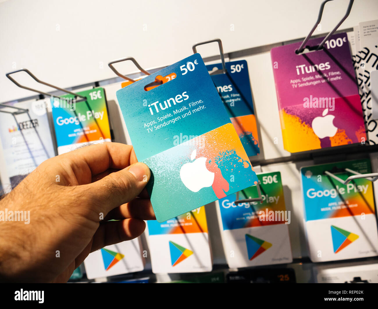 FRANKFURT, GERMANY - OCT 6, 2017: 50 Euro card in man hand point of view  customer shopping for prepaid card online money prepaid cards on shelf for  online applications computer online store Stock Photo - Alamy