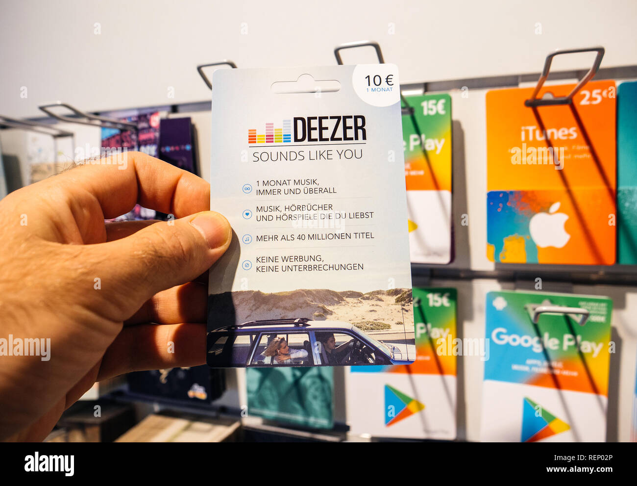 FRANKFURT, GERMANY - OCT 6, 2017: 50 Euro card in man hand point of view  customer shopping for prepaid Deezer Music Gift card online money prepaid  cards online music streaming Stock Photo - Alamy