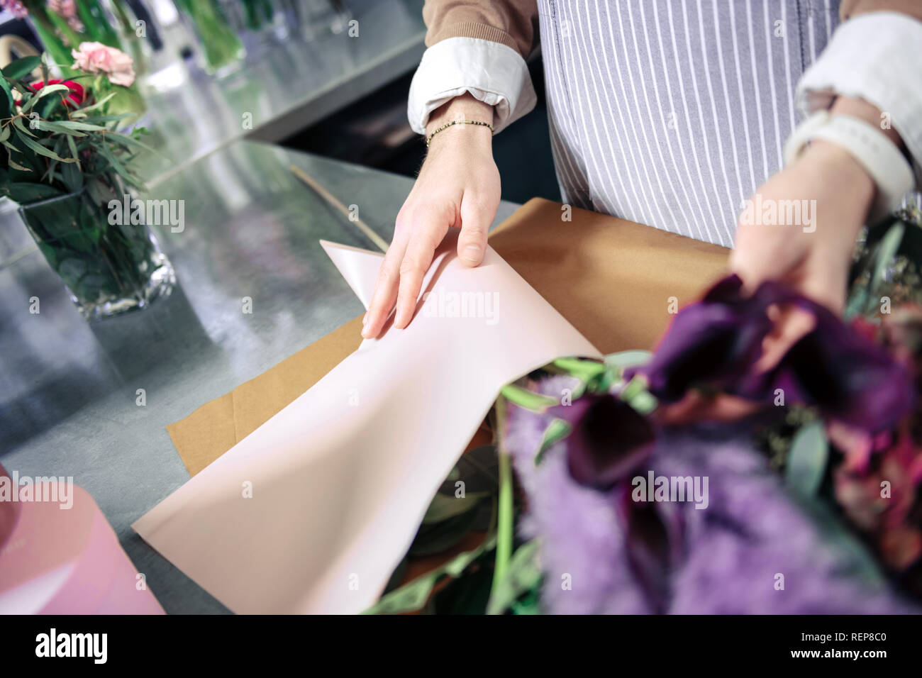 Professional designer working with plants in floral studio Stock Photo