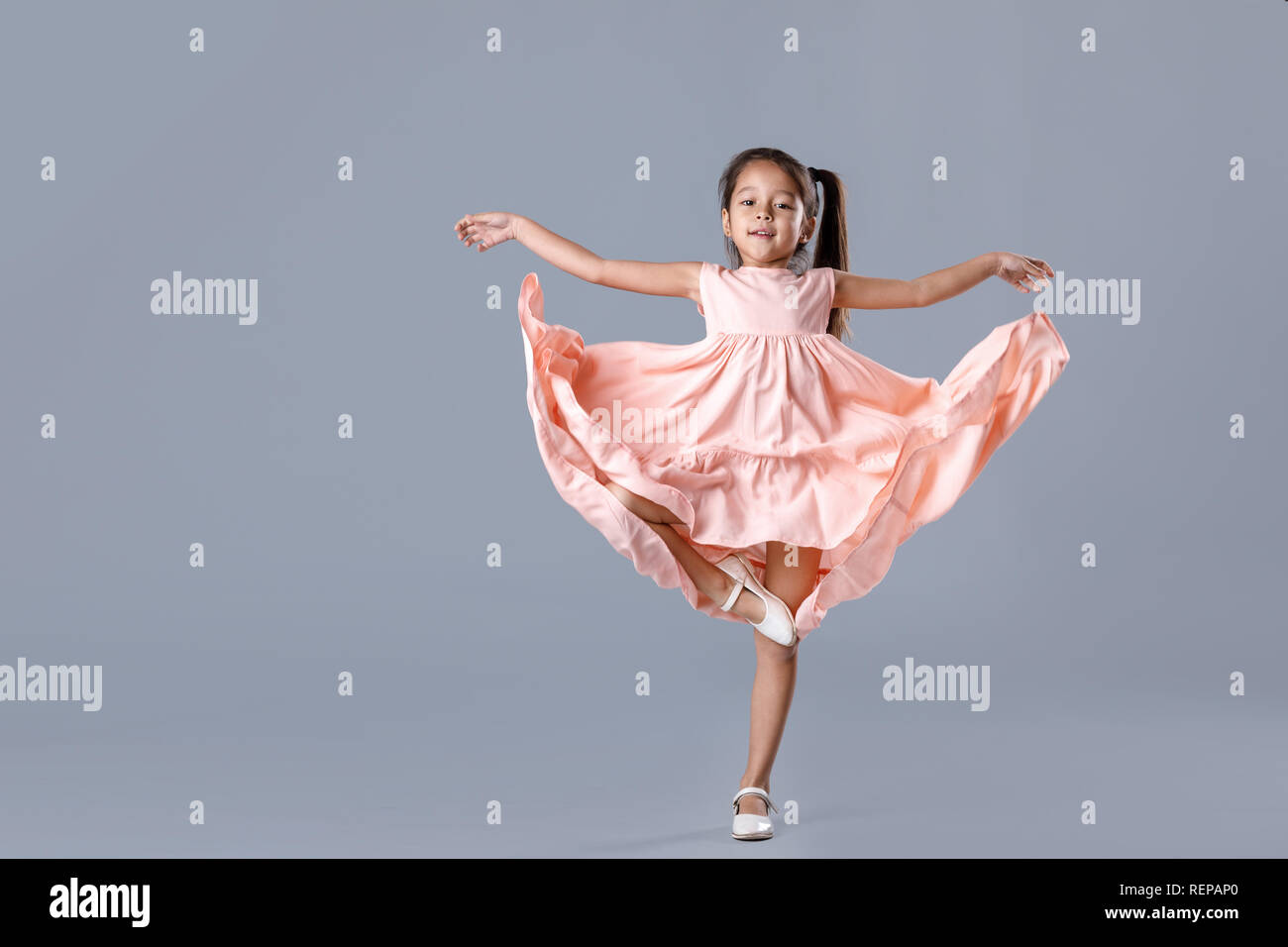 Pretty Little Girl Posing In Elegant Pink Dress Stock
