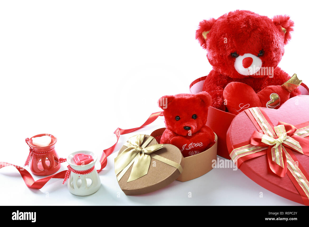 Valentine's Day concept. Red teddy bear in heart shaped gift box with ...