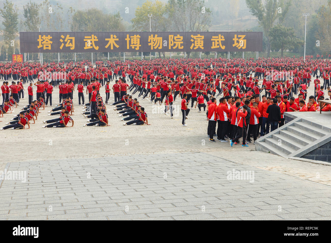 Dengfeng, China - October 16, 2018: Training pupils martial arts school on the square. Shaolin Temple. Stock Photo