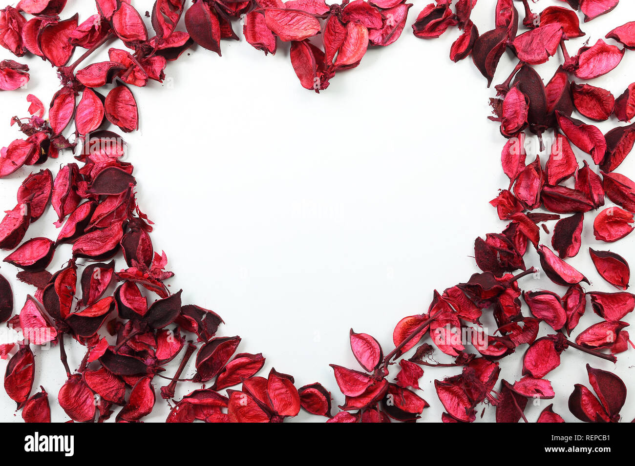 Valentine's Day heart made of red roses frame on isolated white ...