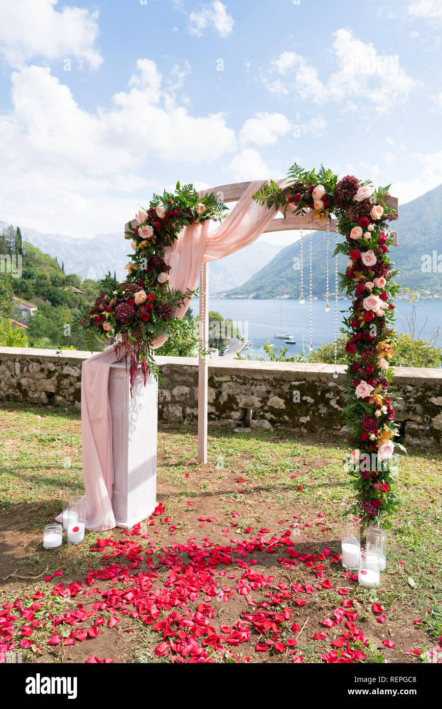 arch decorated with fresh flowers for a wedding ceremony Stock Photo