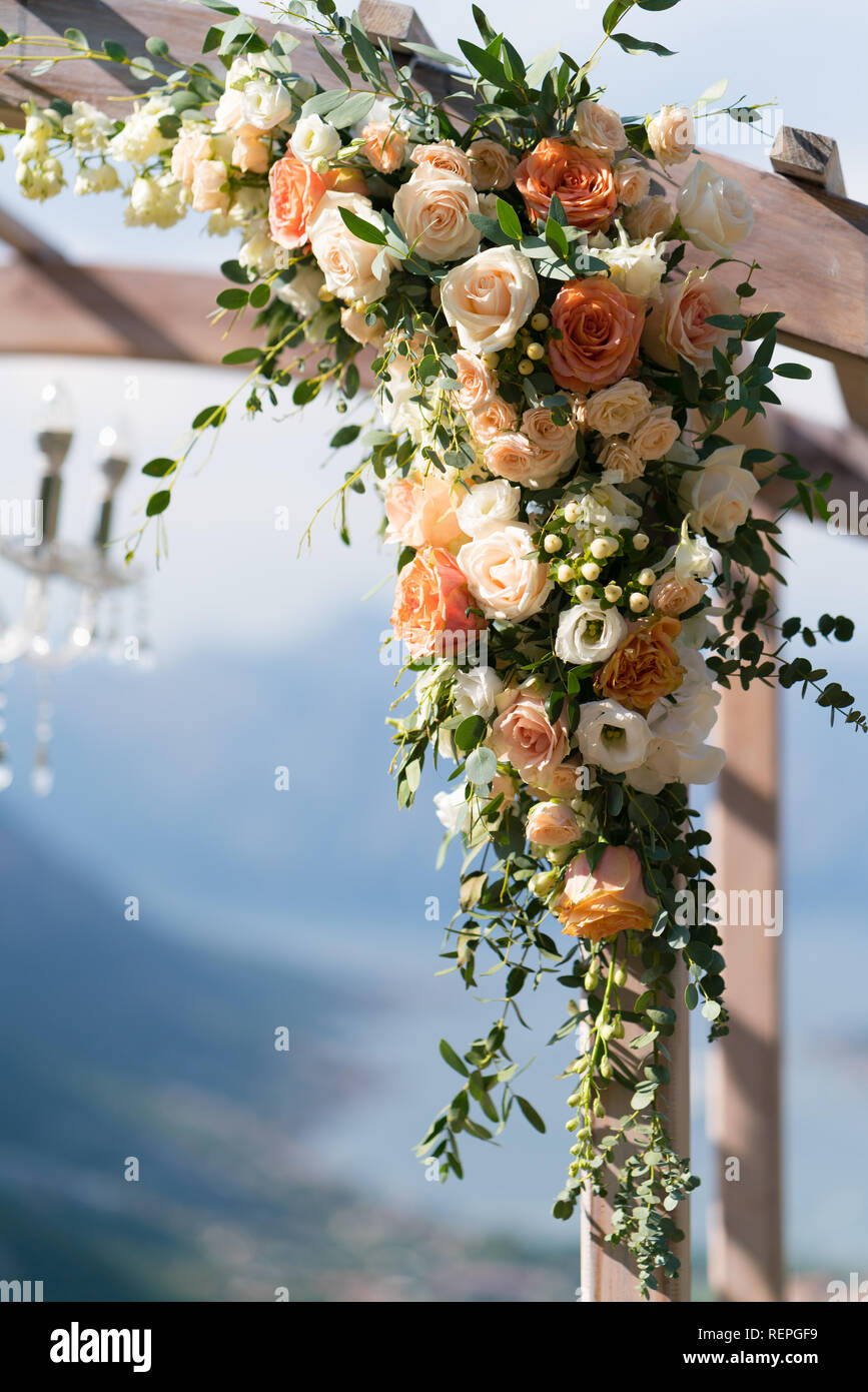 Beautiful wooden wedding arch decorated with flowers Stock Photo Alamy