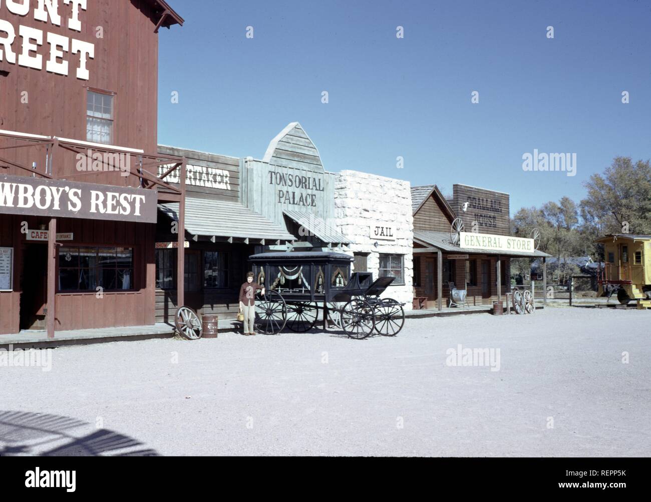 Wild west style street with false facade buildings including jail and Tonsorial Palace on Front Street in Ogallala, Nebraska, 1965. () Stock Photo