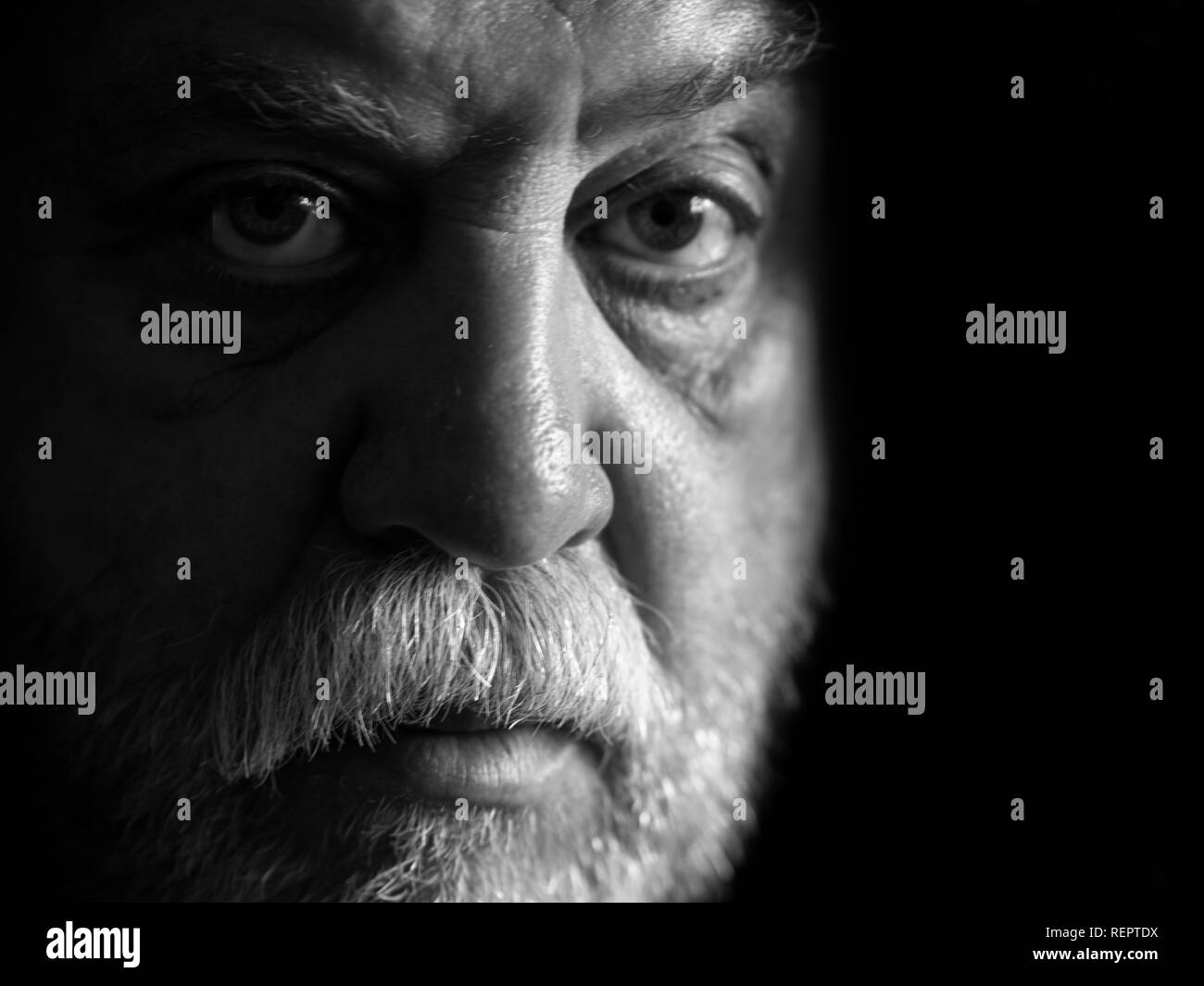 Black and white Portrait of Caucasian man with a mustache and beard Stock Photo