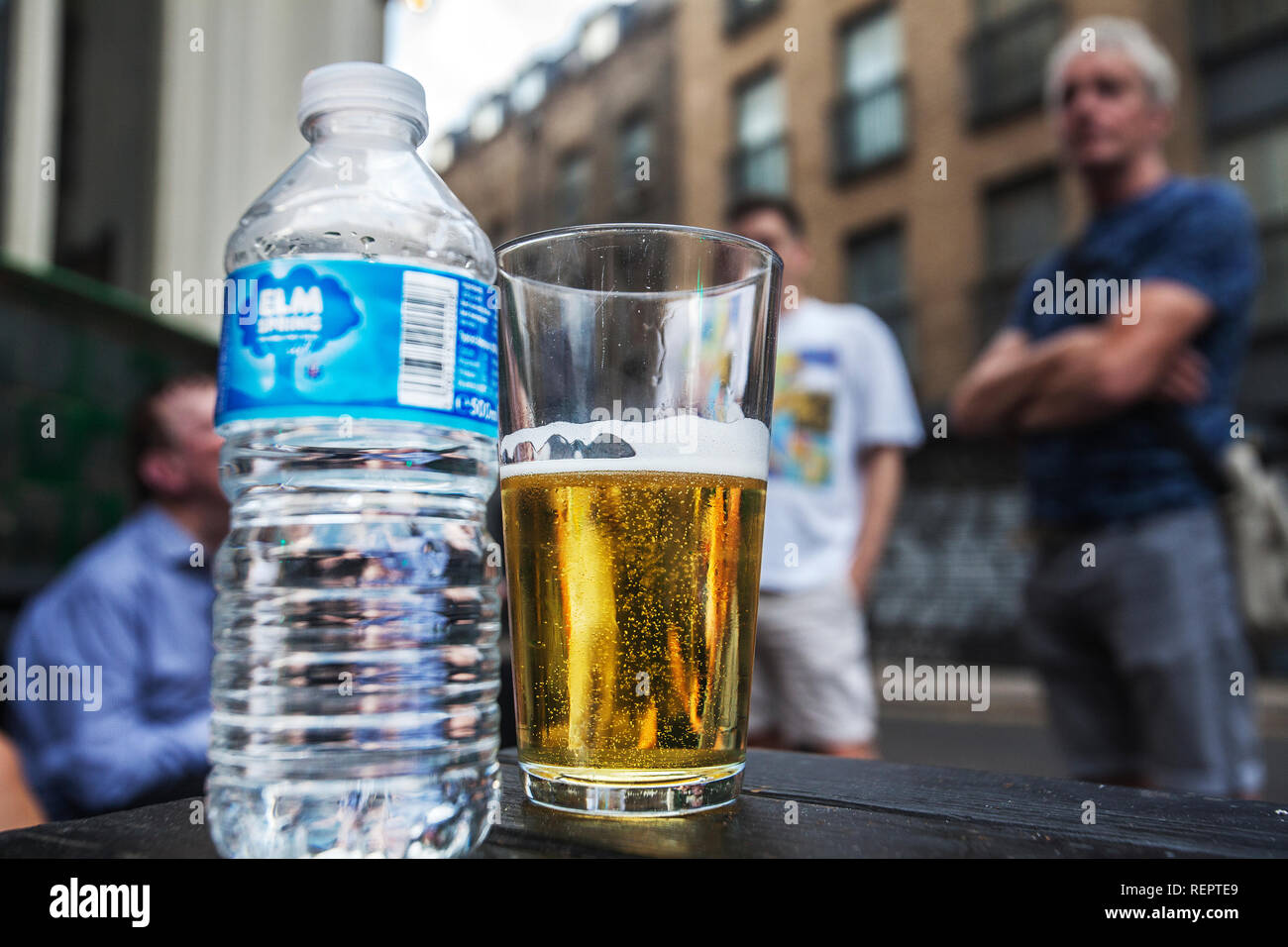 Water bottle and beer glass Stock Photo Alamy
